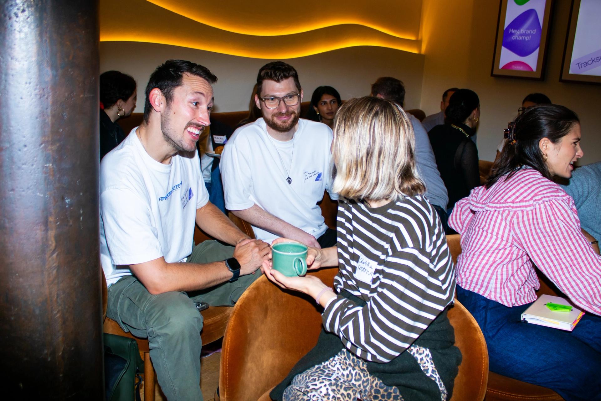 A group of marketing professionals discussing brand building strategies at the Building Brands of the Future event in London