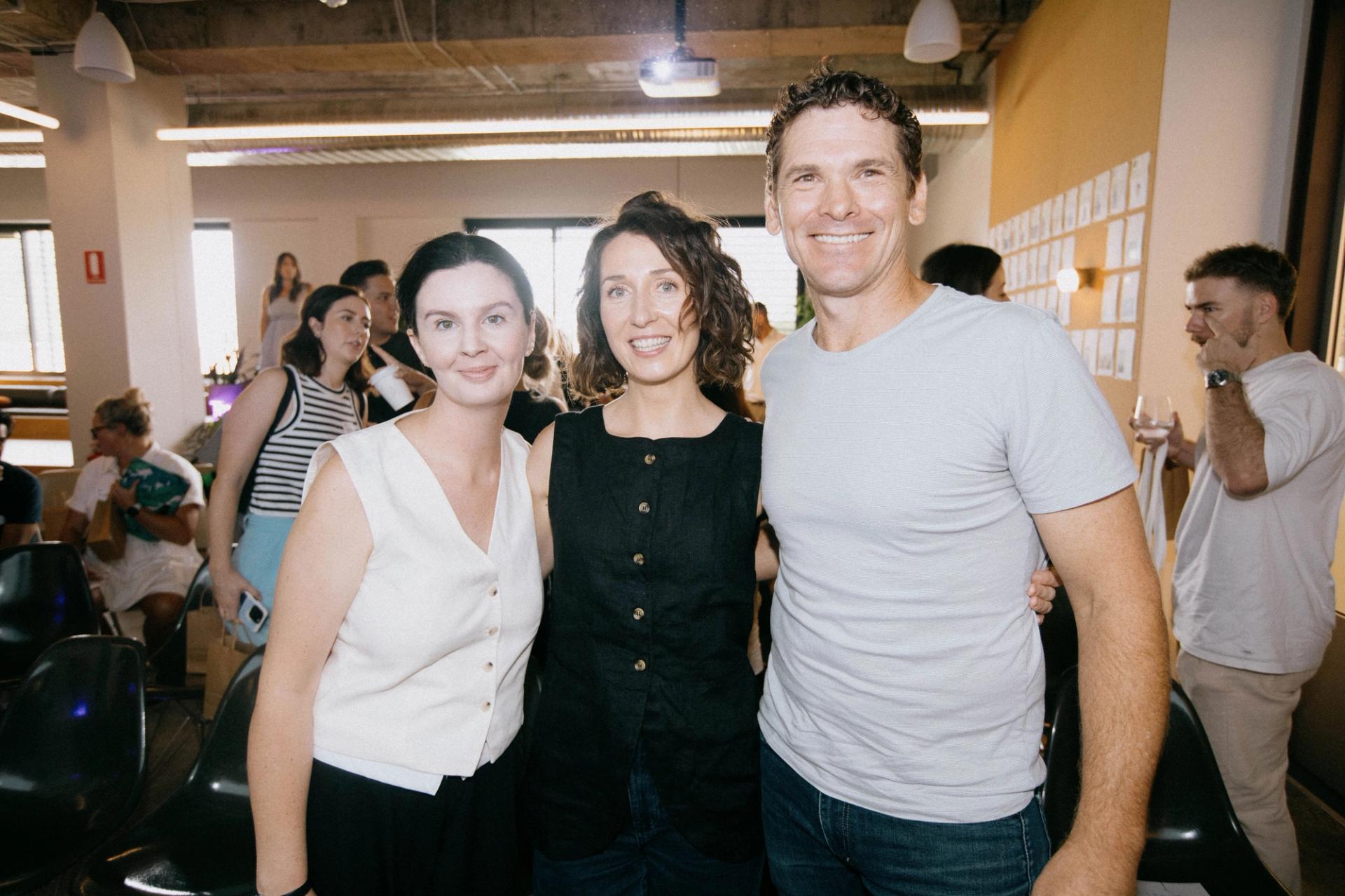 A group of marketing professionals from Frost Collective and Tracksuit posing together at a brand marketing event