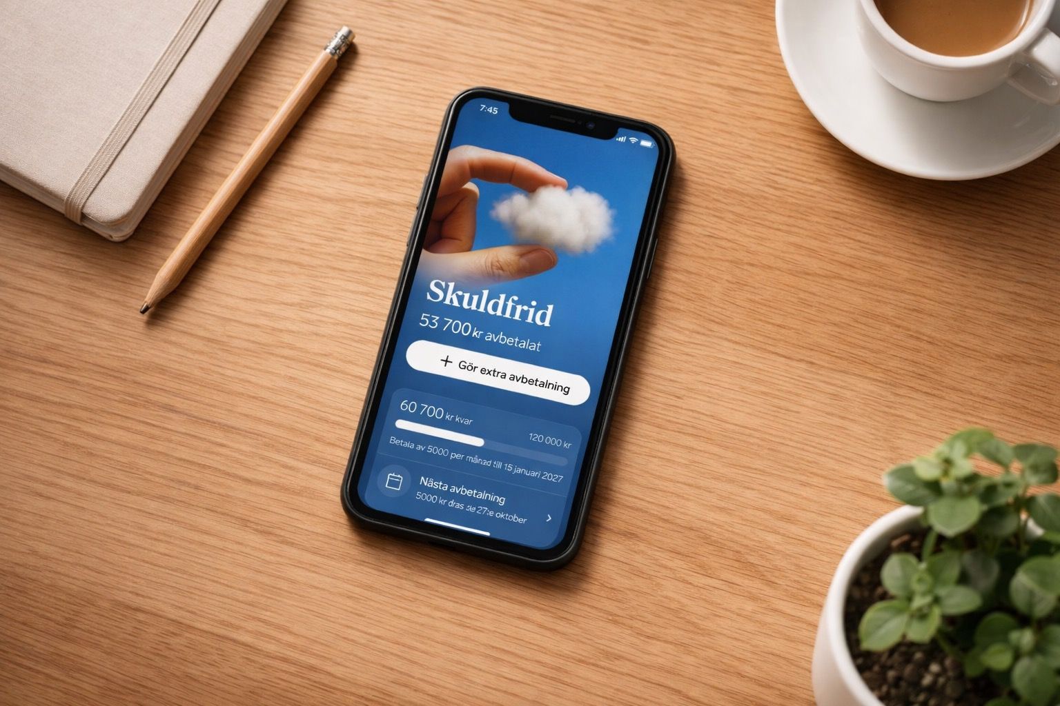 En hand håller en mobiltelefon som visar Dreams-appen med en skuldöversikt