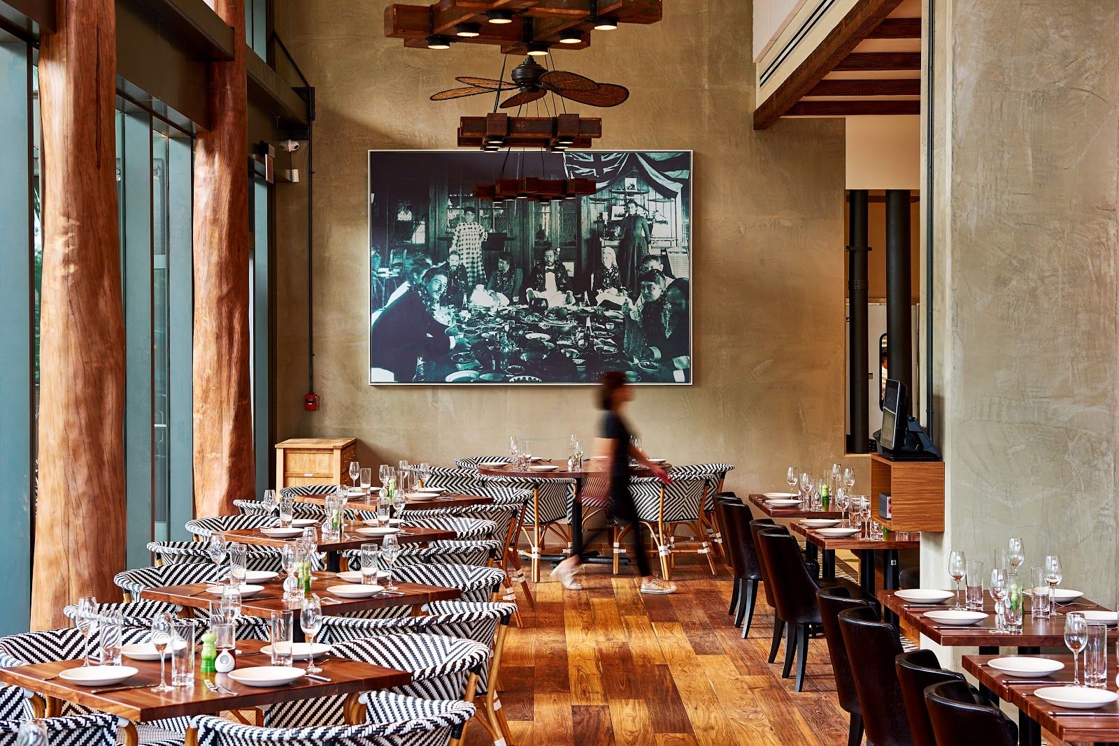 The polished dining room at Merriman's Honolulu set for service.
