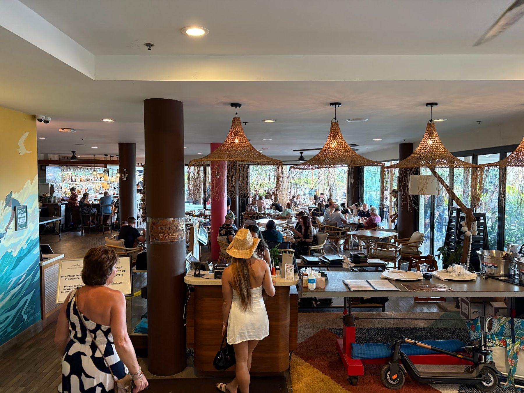 The covered dining room at DECK. with tables set beside the terrace.