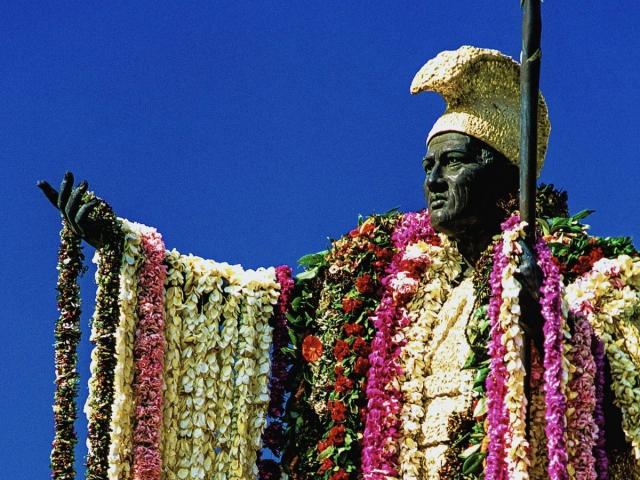 A statue of King Kamehameha draped in lei
