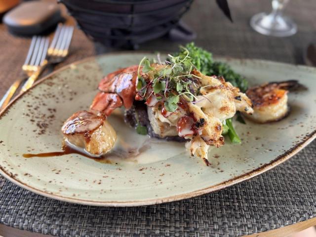 Exquisite lobster tail and seared scallops dish showcasing Kauai fine dining excellence