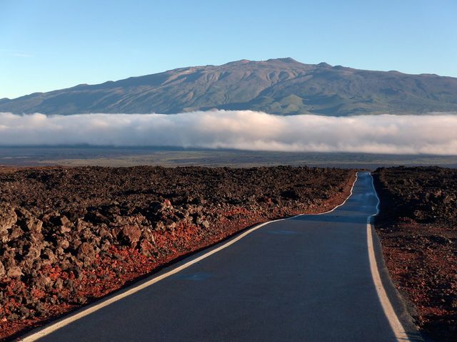 A broad volcanic road scene on Hawaiʻi Island.