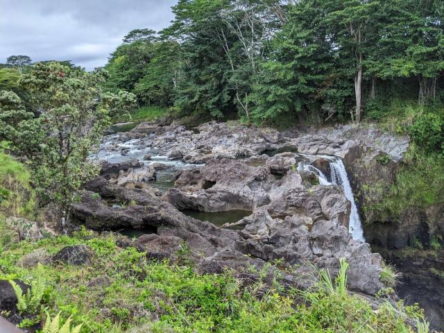 Rainbow Falls surrounded by lush greenery near Hilo on Hawaiʻi Island.