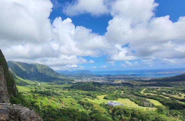 Windward Oahu's green cliffs and coast viewed from Nuuanu Pali Lookout.