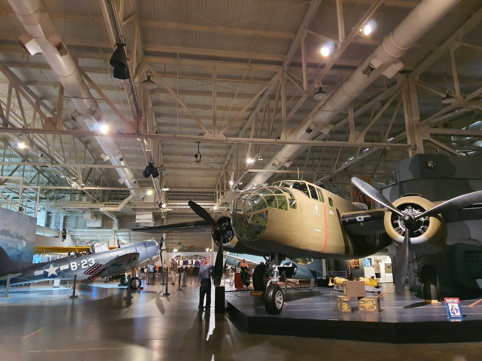 Large historic aircraft displayed inside a hangar at Pearl Harbor Aviation Museum on Ford Island.