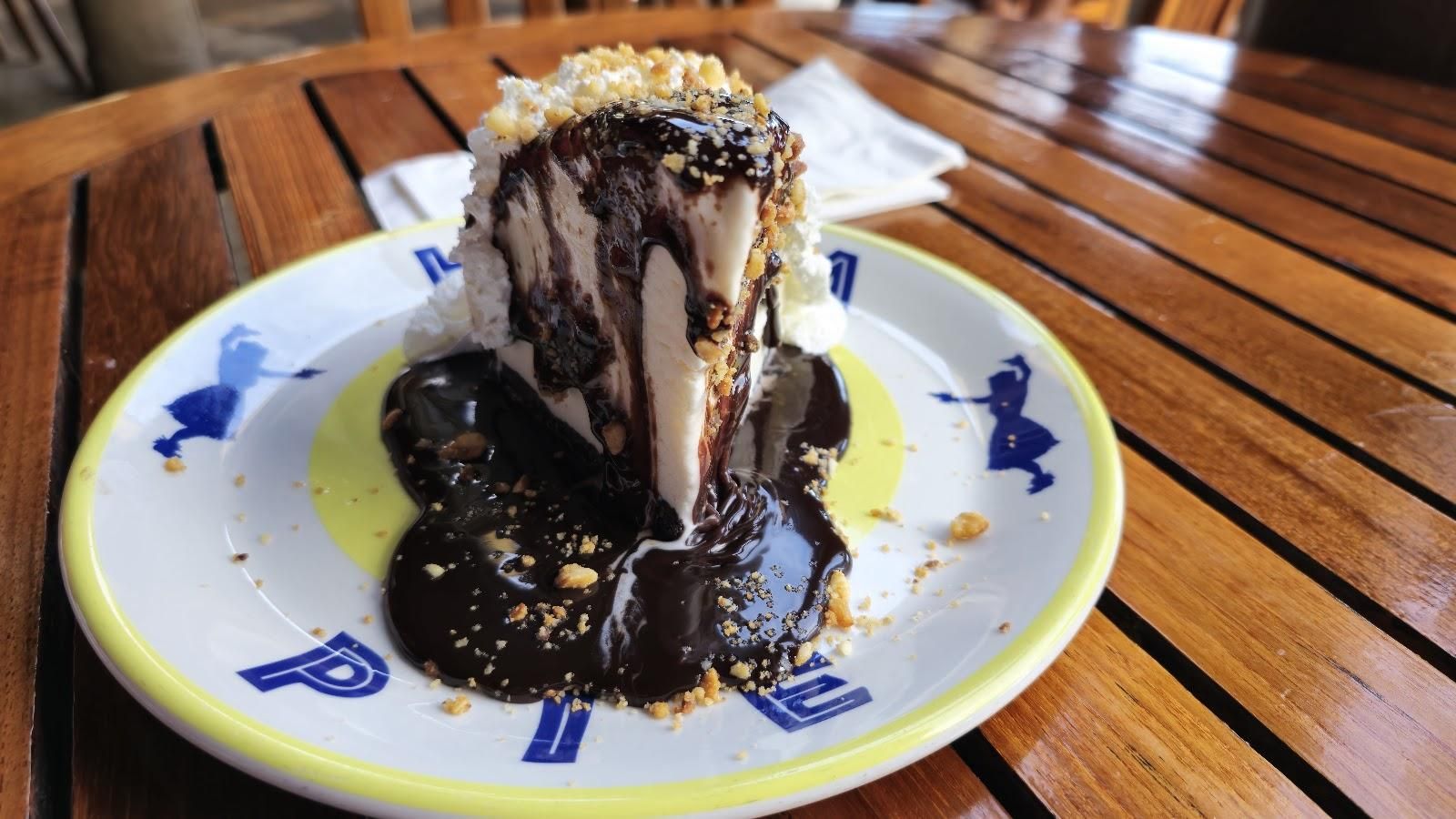 Famous Dukes Hula Pie dessert with chocolate drizzle and macadamia nuts, a family favorite