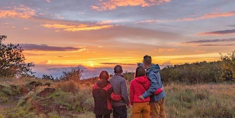 a family enjoying a sunset on the Big Island