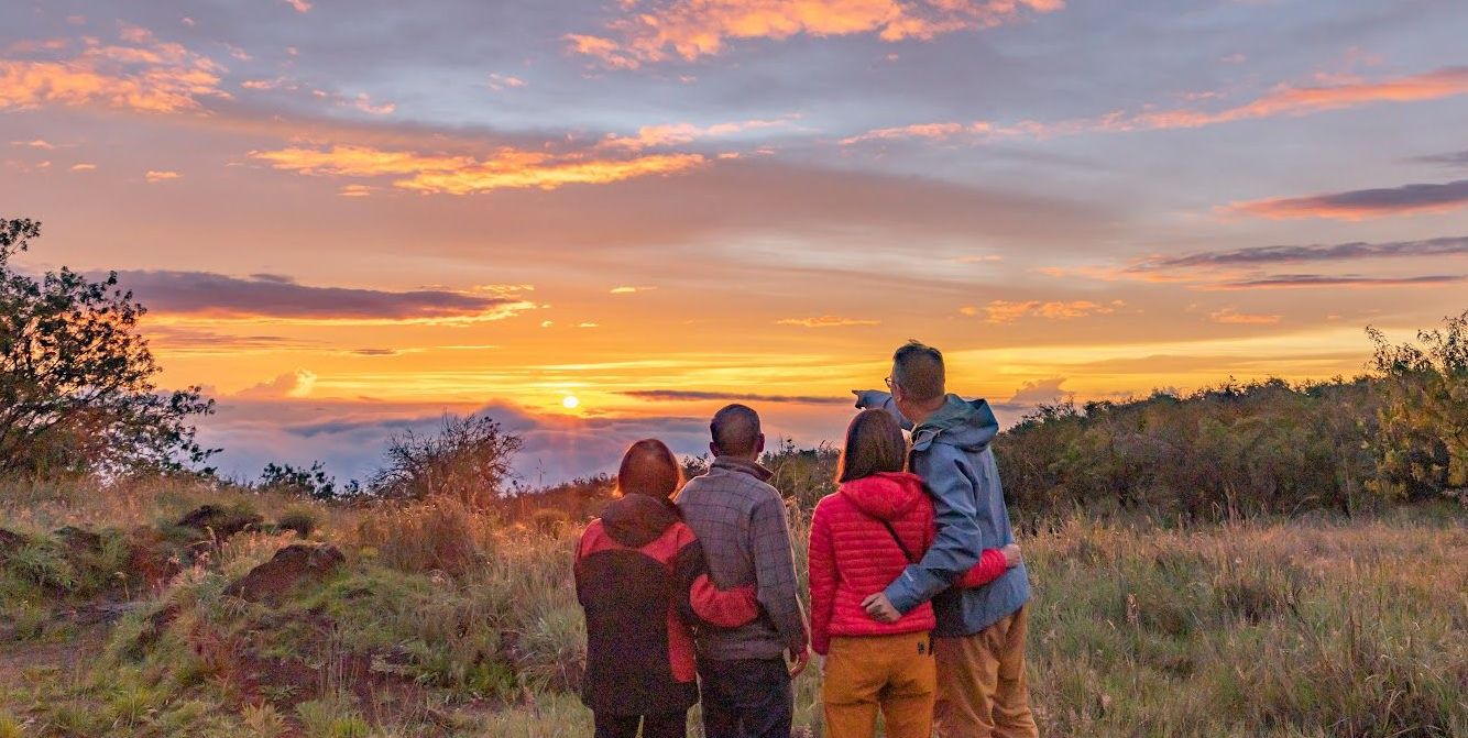 a family enjoying a sunset on the Big Island