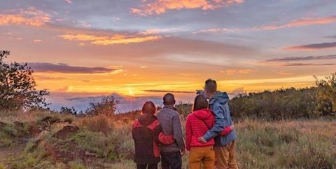 a family enjoying a sunset on the Big Island