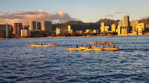 Canoe clubs practicing off Waikiki