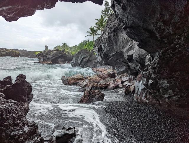 black sand beach and sea cave in East Maui