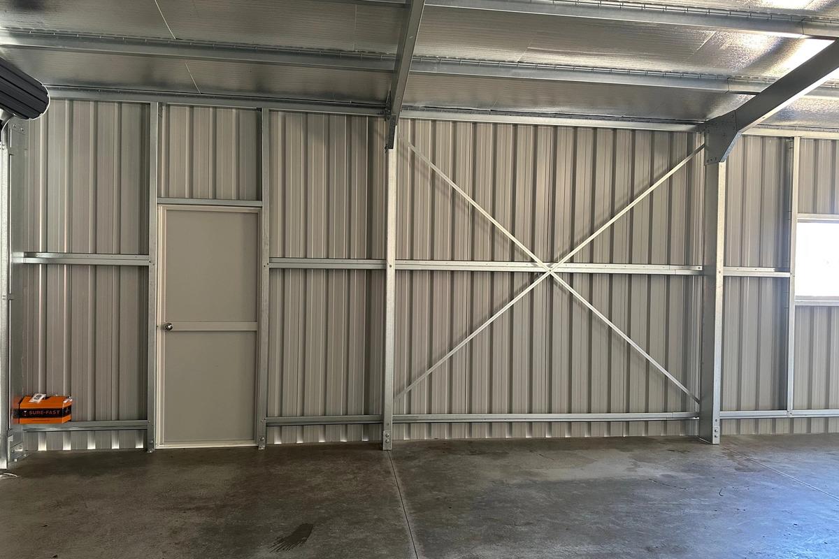 Walk-in door and wall cross-bracing inside the garage