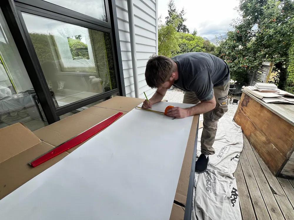 measuring to cut wallpaper