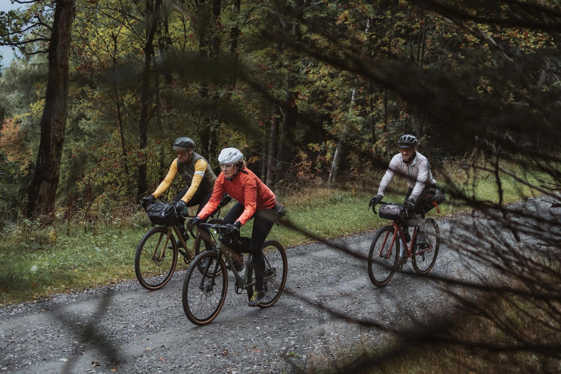 Three riders gravel road — Björn Lexius, Sauerland, Germany