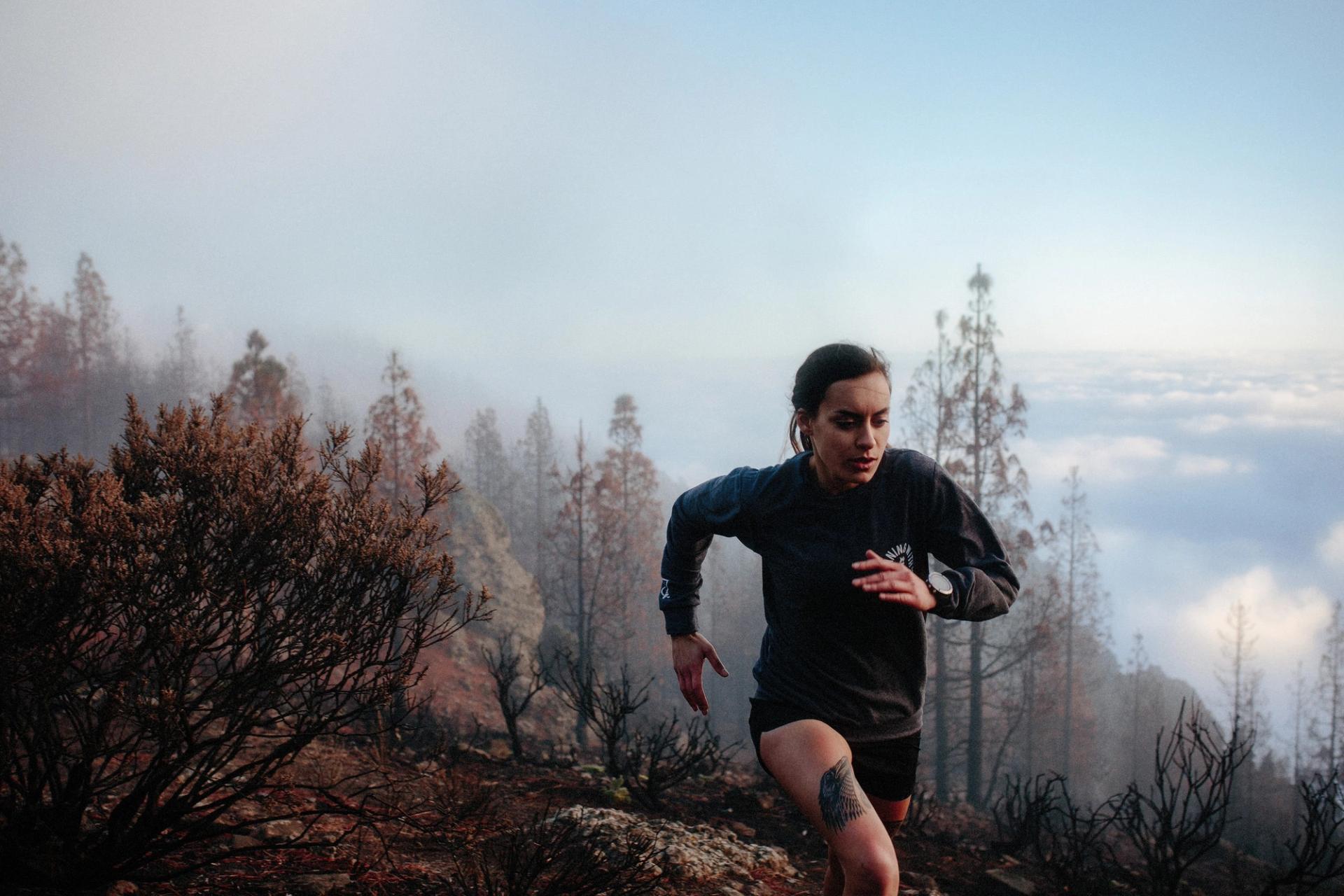Female runner above clouds — Björn Lexius, Gran Canaria, Spain