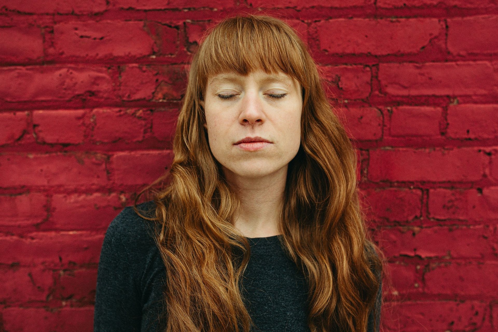 Close portrait red wall — Björn Lexius, Brooklyn, New York