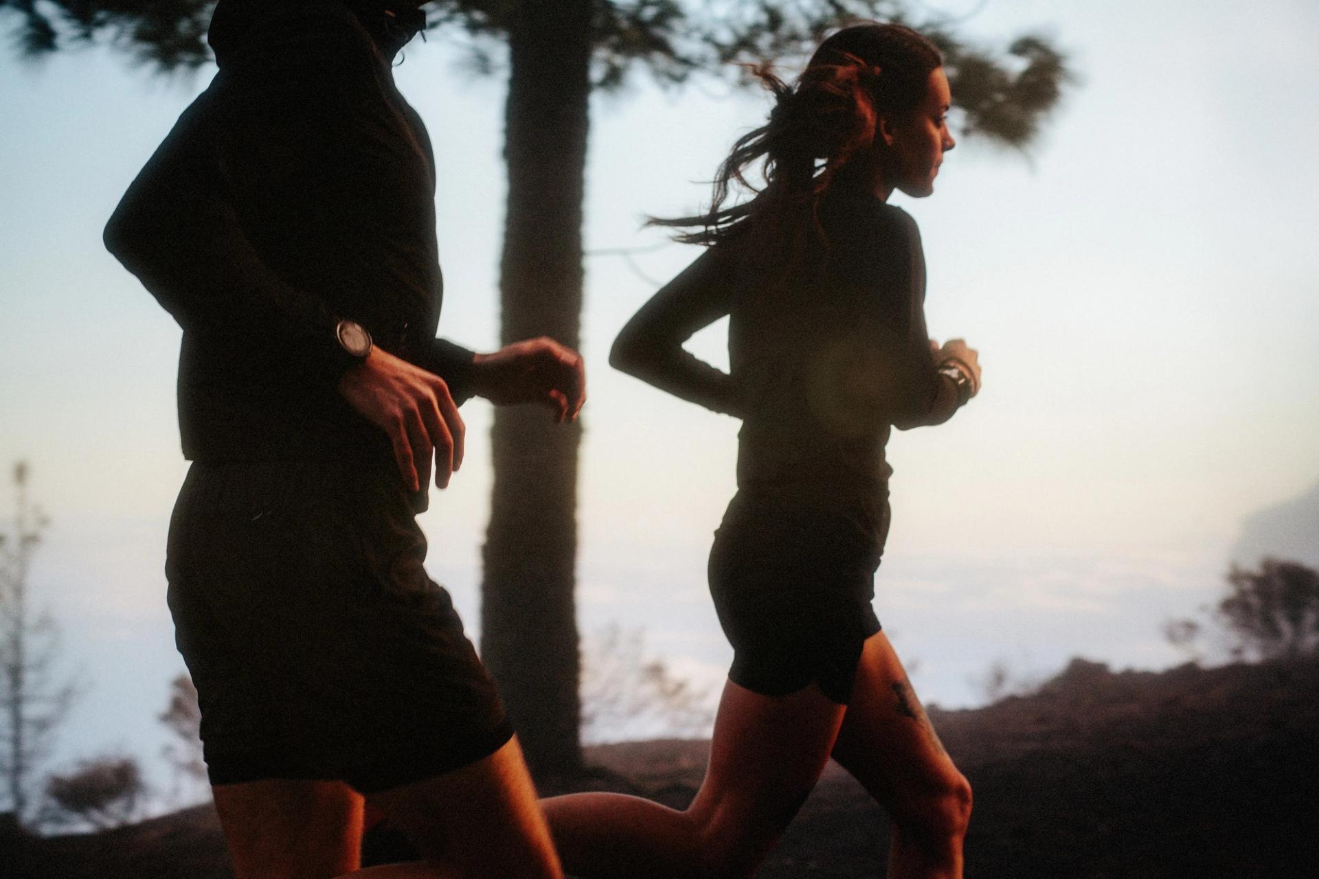 Two runners backlit sunset — Björn Lexius, Gran Canaria, Spain