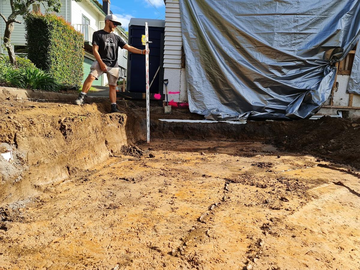 Excavated site cut beside the house at the start of the build