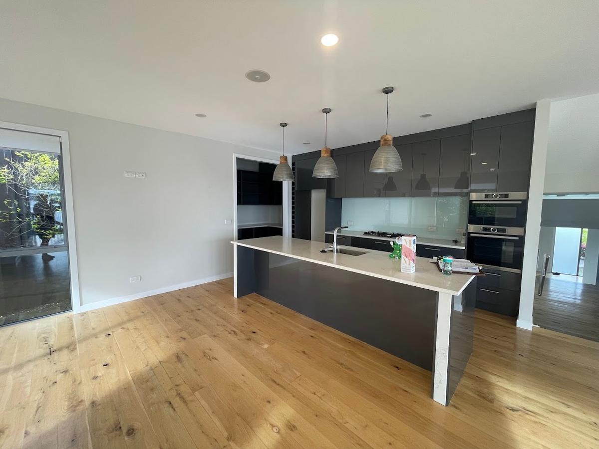 The original dark grey kitchen before the renovation