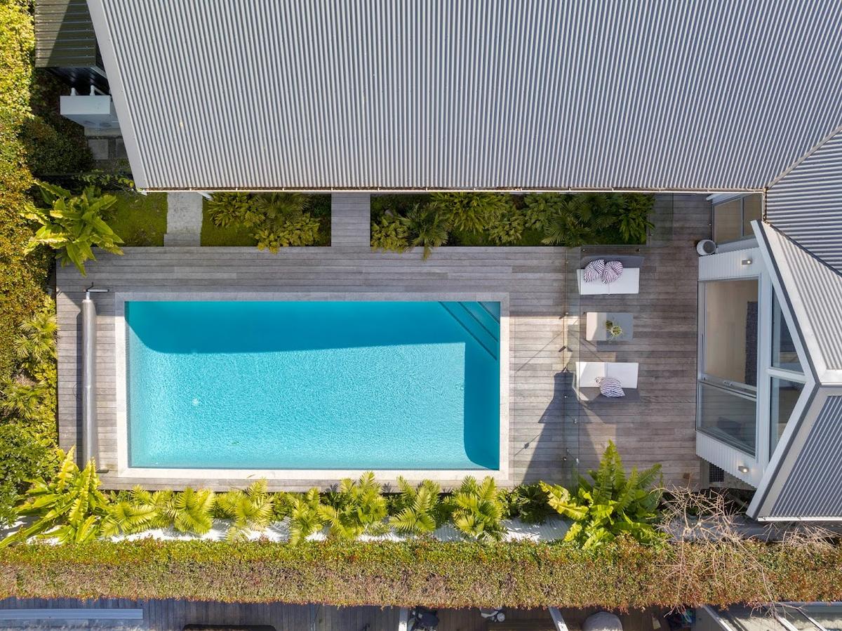 Overhead view of the pool, timber deck and corrugate roofline