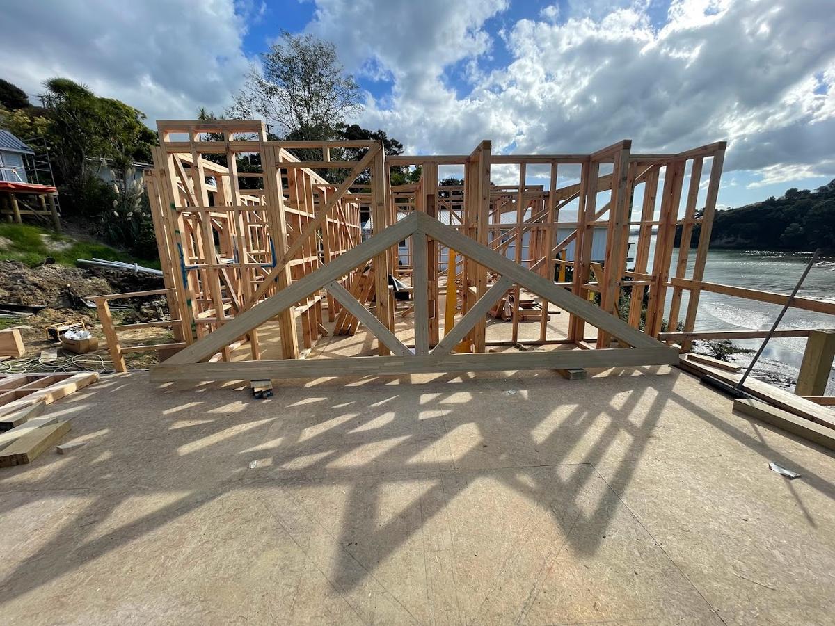 Timber roof truss assembled on site beside the estuary