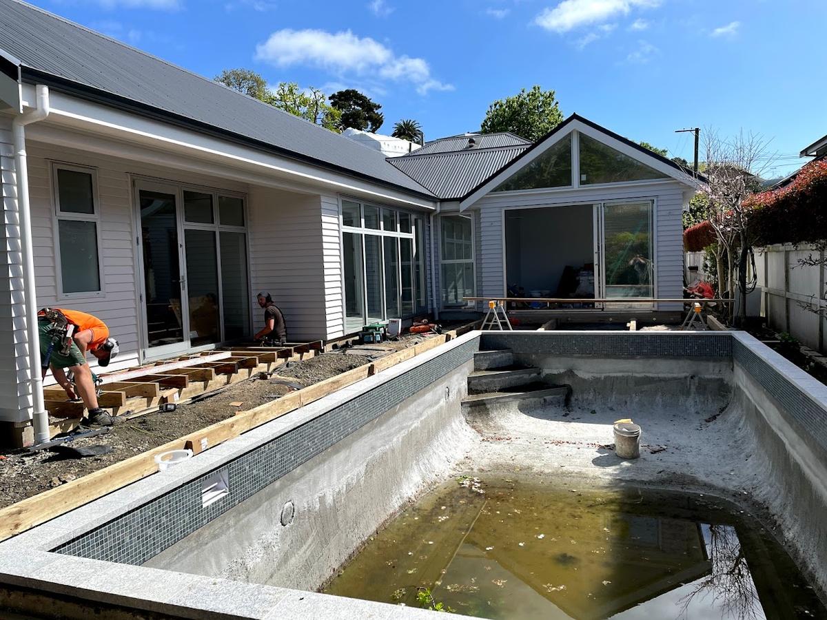 Decking going down beside the newly formed pool shell