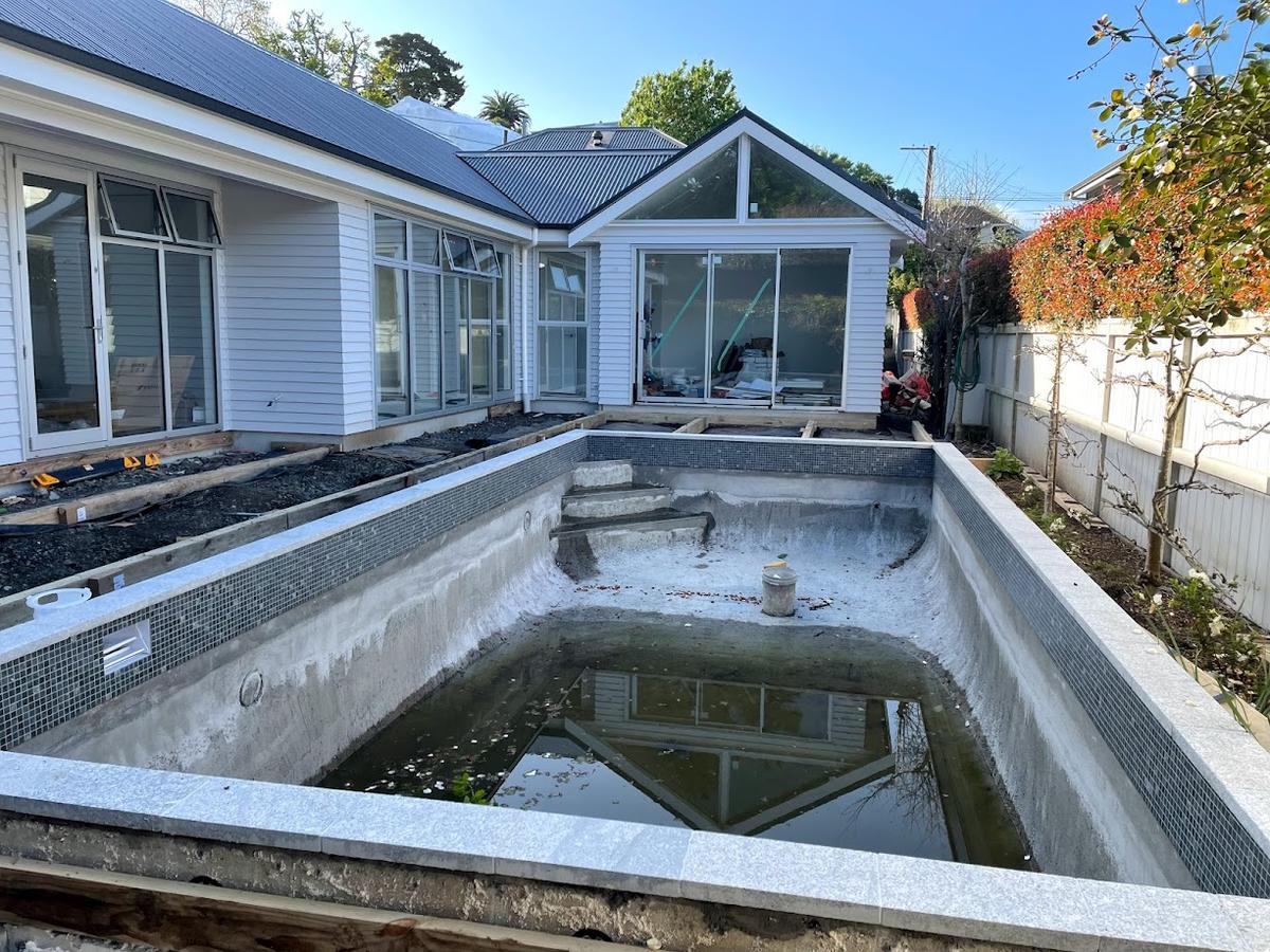 Concrete pool shell formed alongside the finished extension