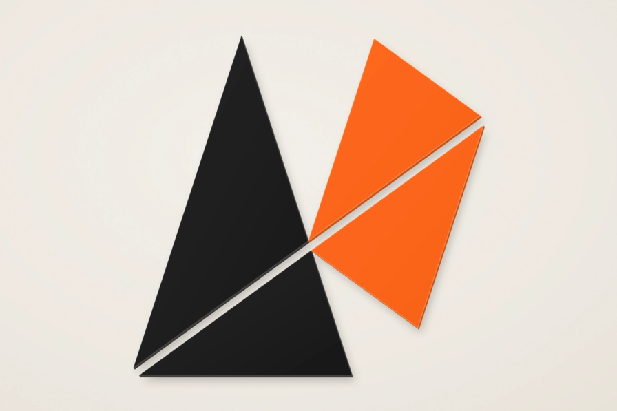 The AgentBuild cutmark: four matte triangles, two ink and two tangerine, in low relief on a cream ground.
