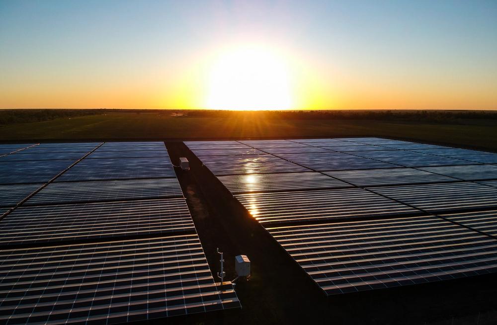 NOJA Power GMK in service as a generation point of connection within a solar farm with the sun setting in the background