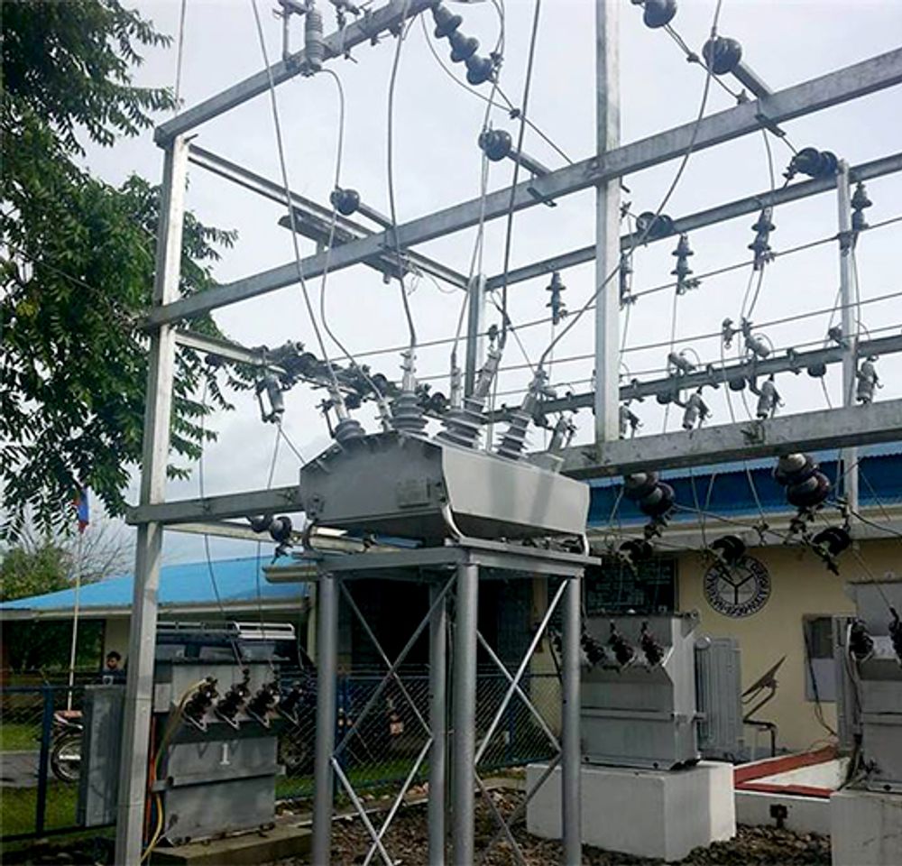 Close up of NOJA Power OSM Recloser in the centre of an island substation installation in the Philippines