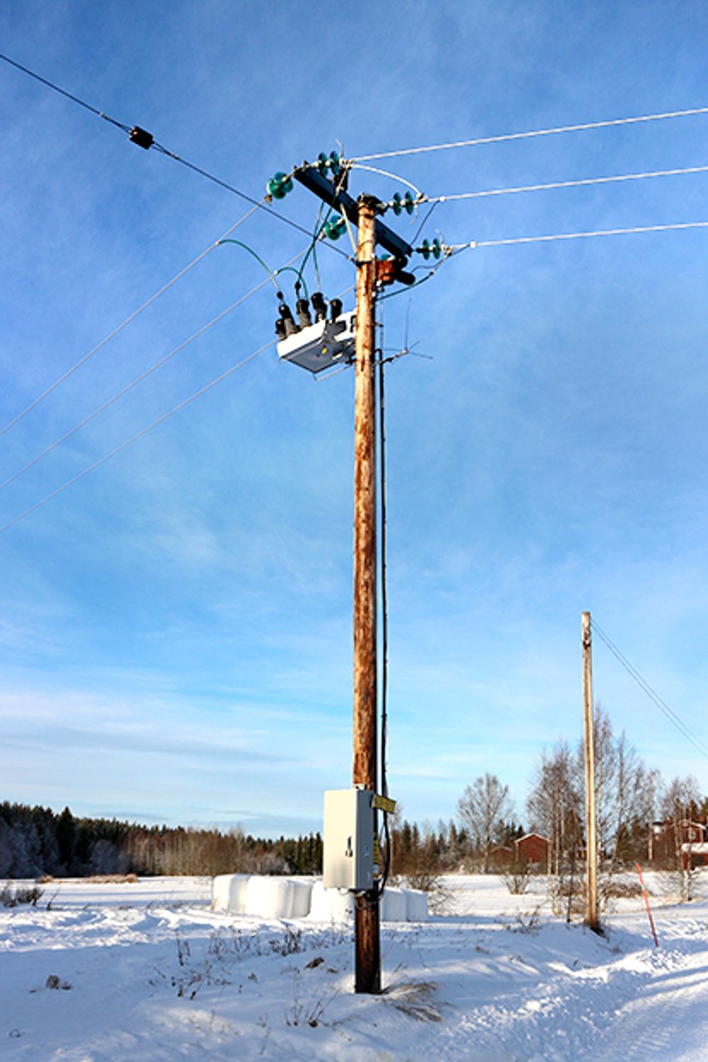 NOJA Power OSM Recloser Installation in Sweden, surrounded by snow