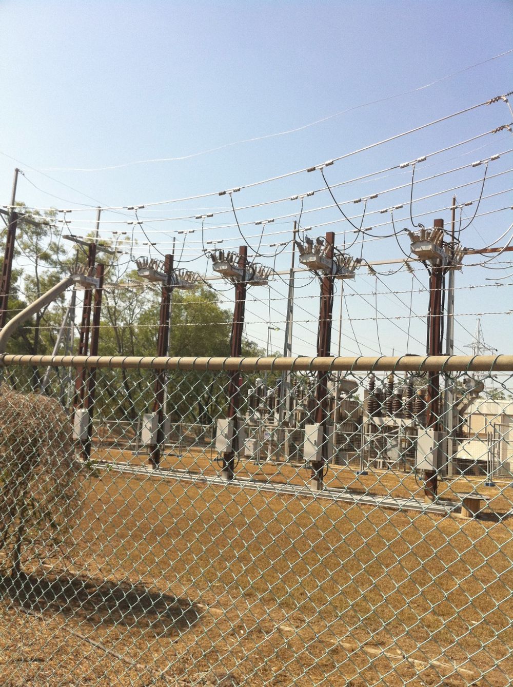 Five NOJA Power installations in substation array behind a chain fence in Northern Territory, Australia 