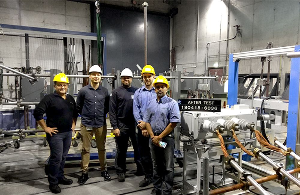 Group of NOJA Power Staff at the KEMA Laboratory standing next to the VISI-SWITCH®