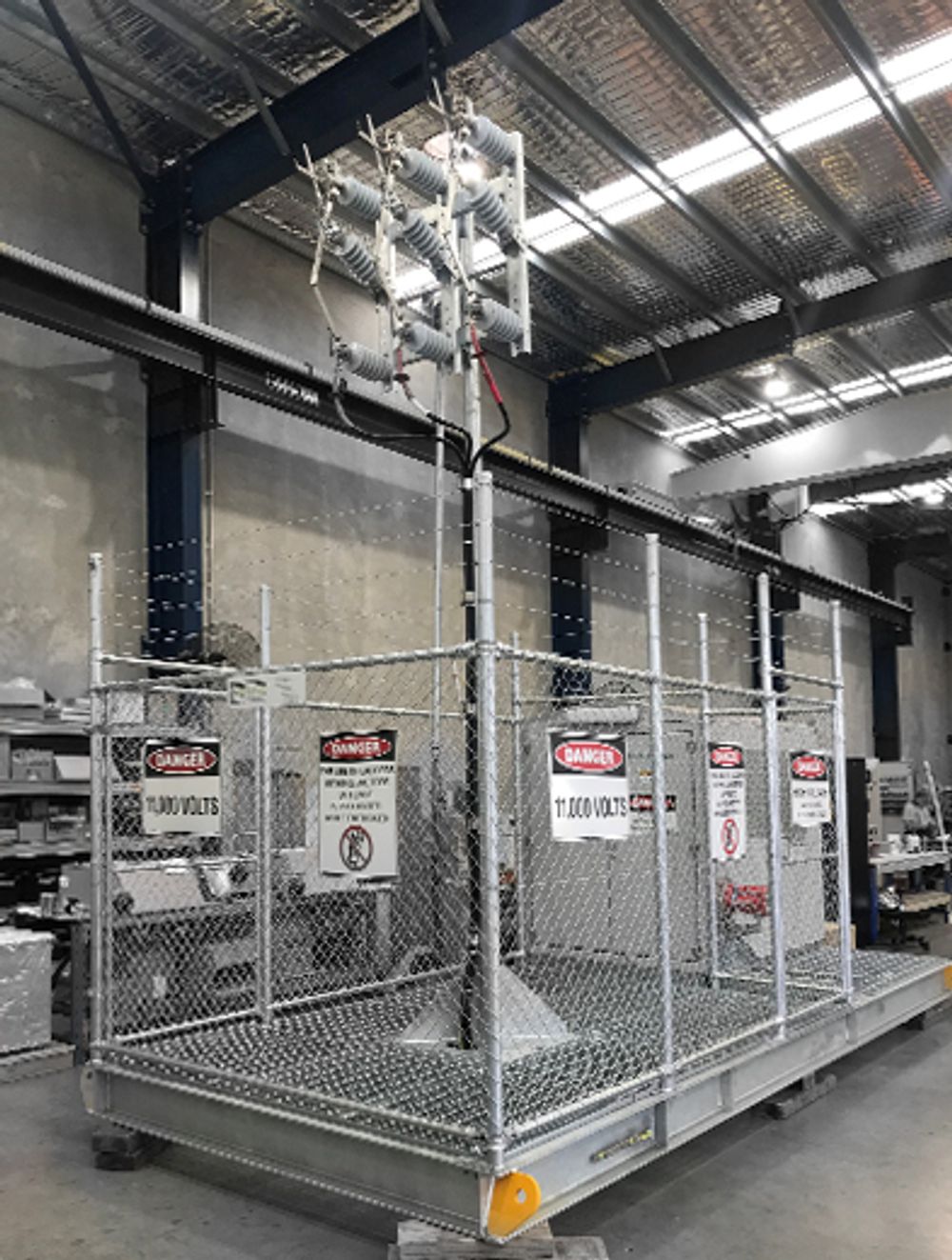 A NOJA Power-Powins mobile substation overhead unit is mounted in a warehouse
