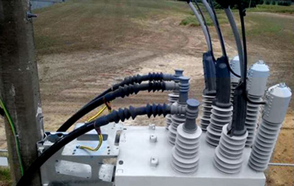 Close up of NOJA Power 38kV OSM Recloser with Overhead and Underground Cable Terminations