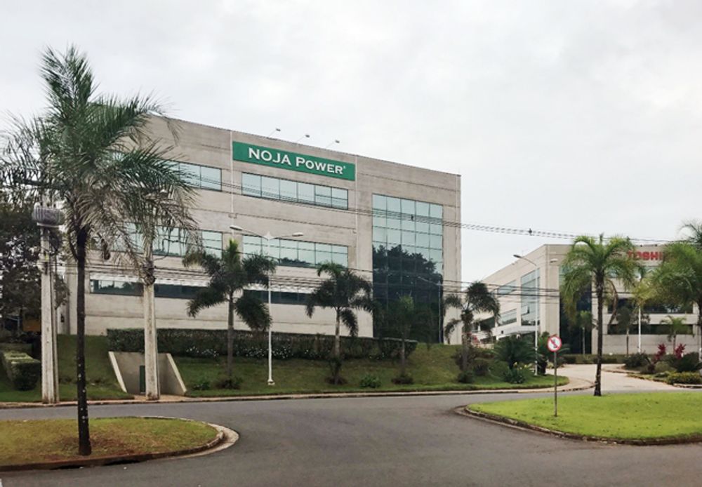 Light coloured office building with NOJA Power canopy over entrance 