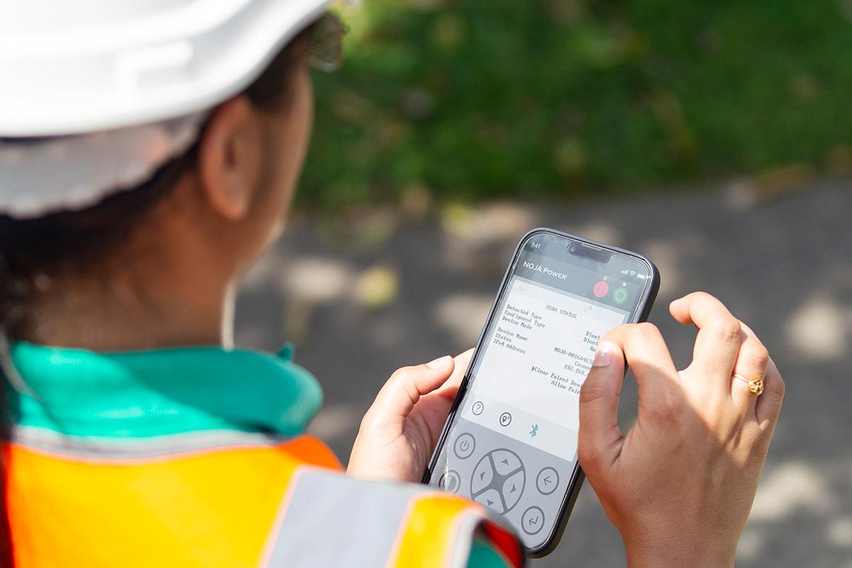 Engineer using NOJA Power's Remote HMI App