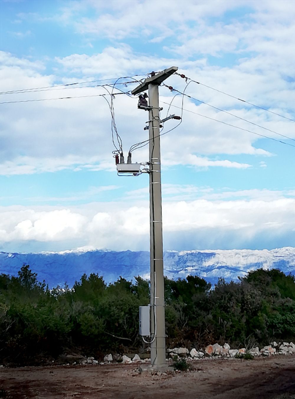 NOJA Power OSM Recloser Installation with snow mountains in the background