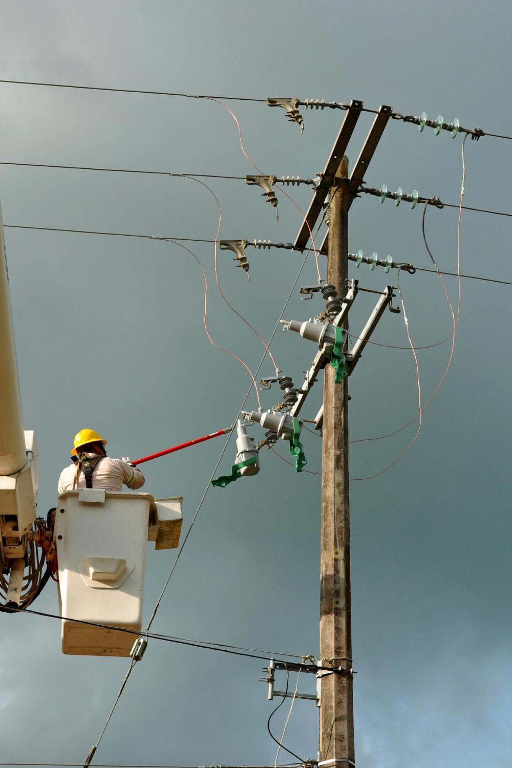 Utility engineers energising the NOJA Power EcoLink, using the patented Interlock Lever