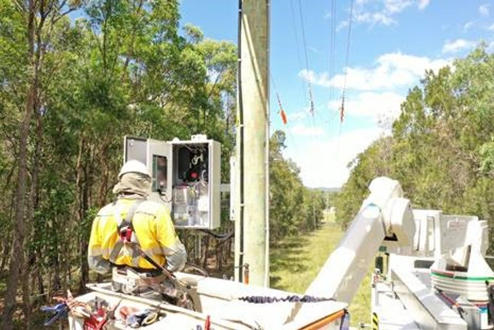 Image of a lineworker facing the first NOJA Power RC20 Controller with PMU capability commissioned in service.