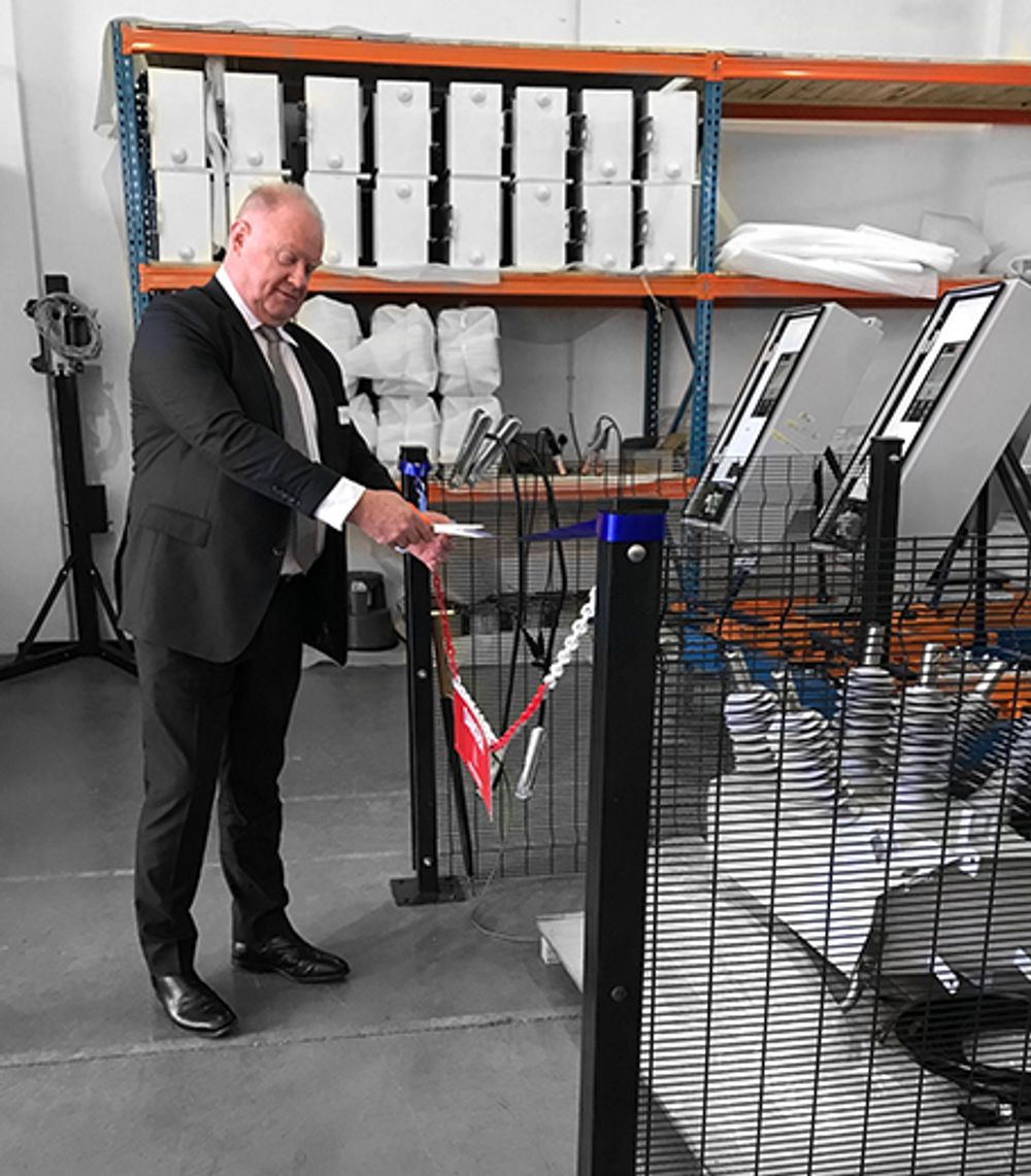 NOJA Power Group Managing Director Neil O’Sullivan cuts the ribbon opening the new RWW NOJA Power Production Line in Laser Park South Africa