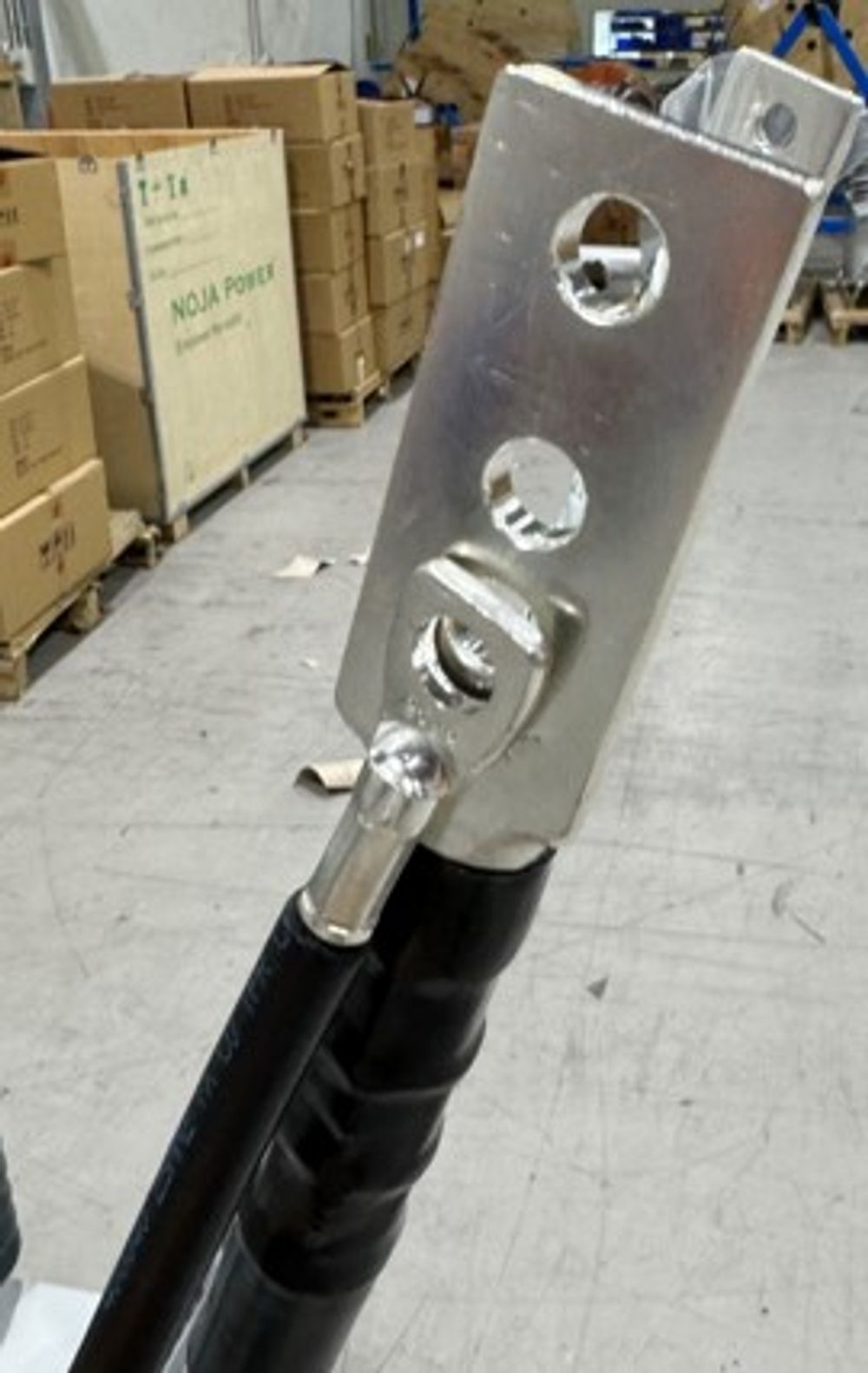 Figure 2 – A close up of the switchgear termination (large lug) and surge arrestor termination (small lug). These are bolted together in the field installation