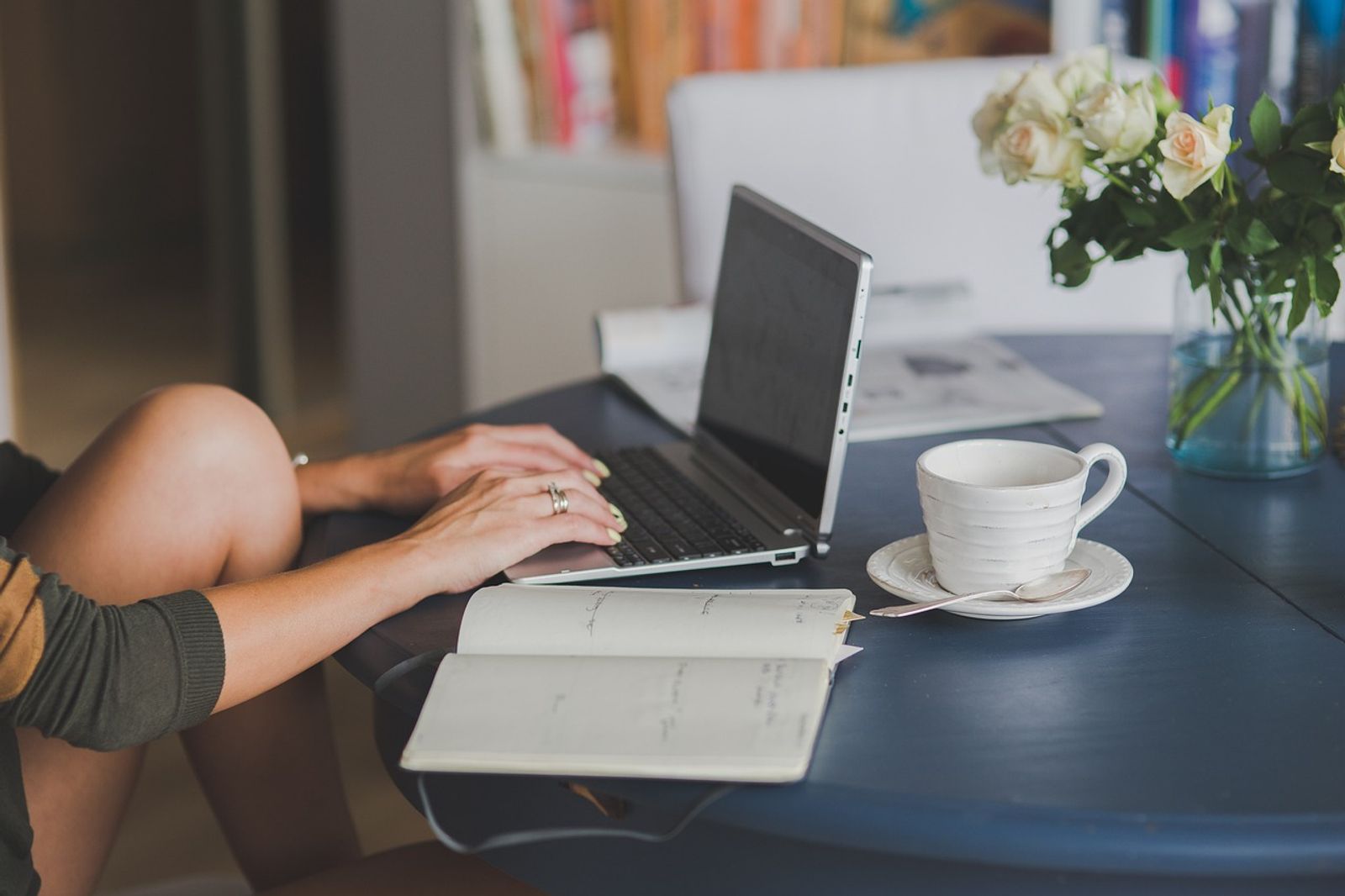 Business analyst and QA engineer pairing at a standing desk to write plain English test steps while comparing testsigma alternatives for codeless automation