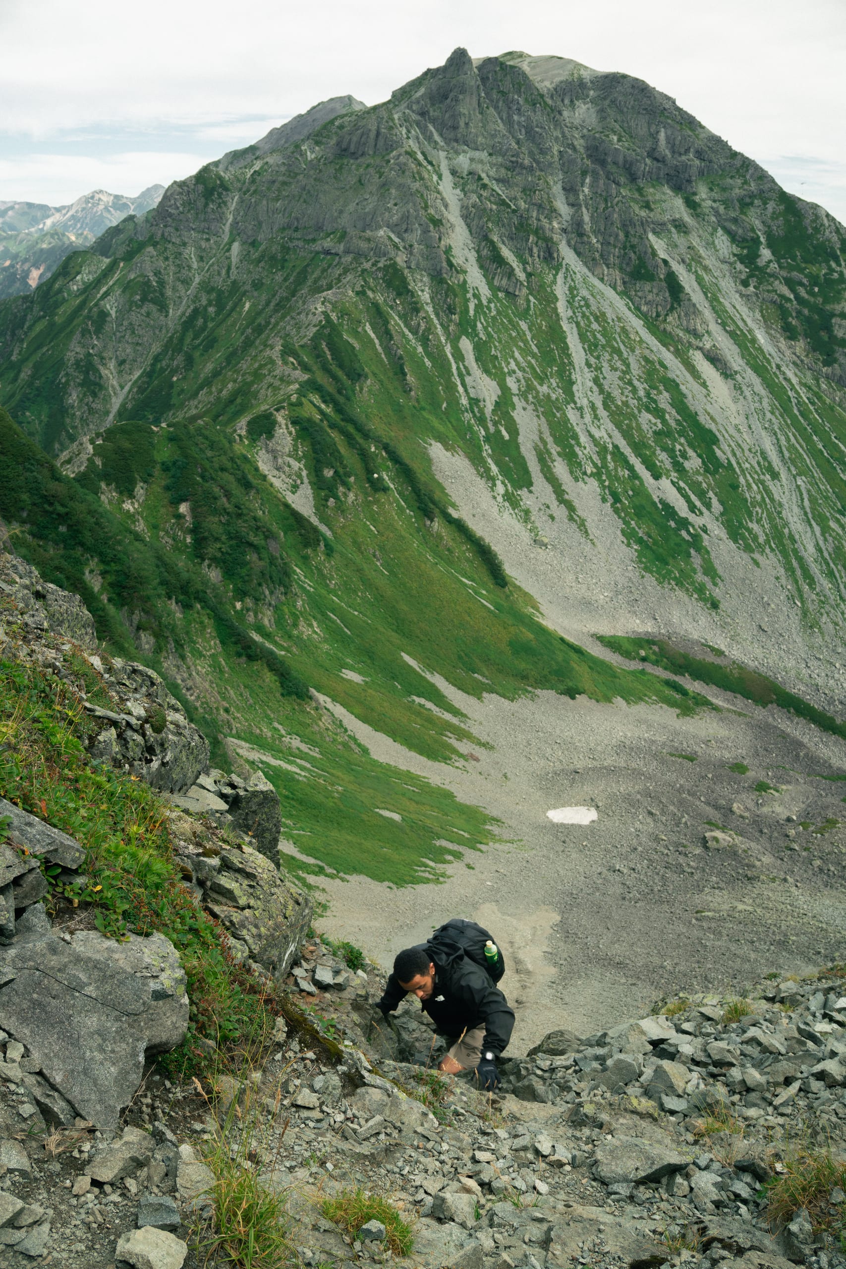 Hiker ascends the mountain