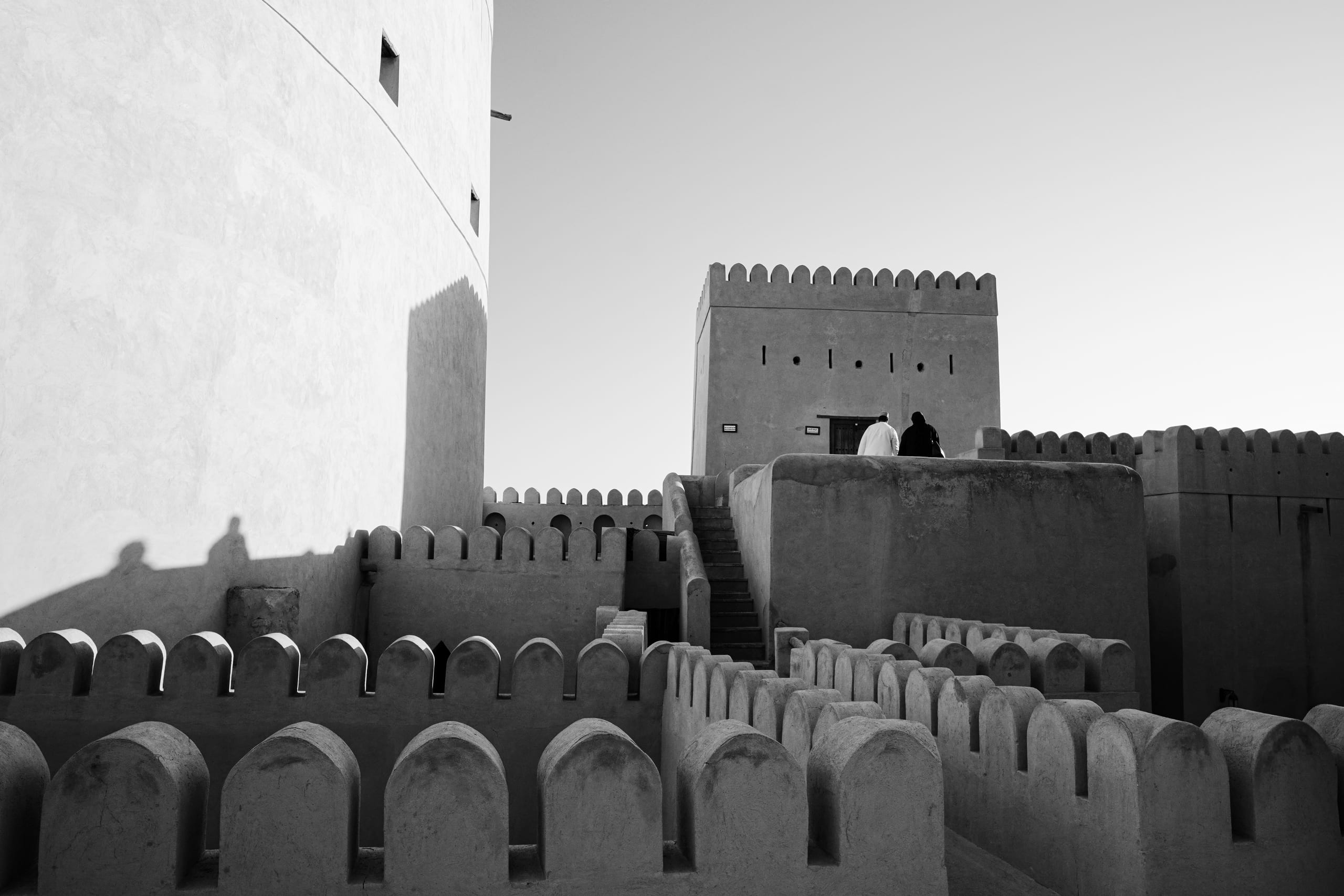 A couple sit on a terrace in the fort.