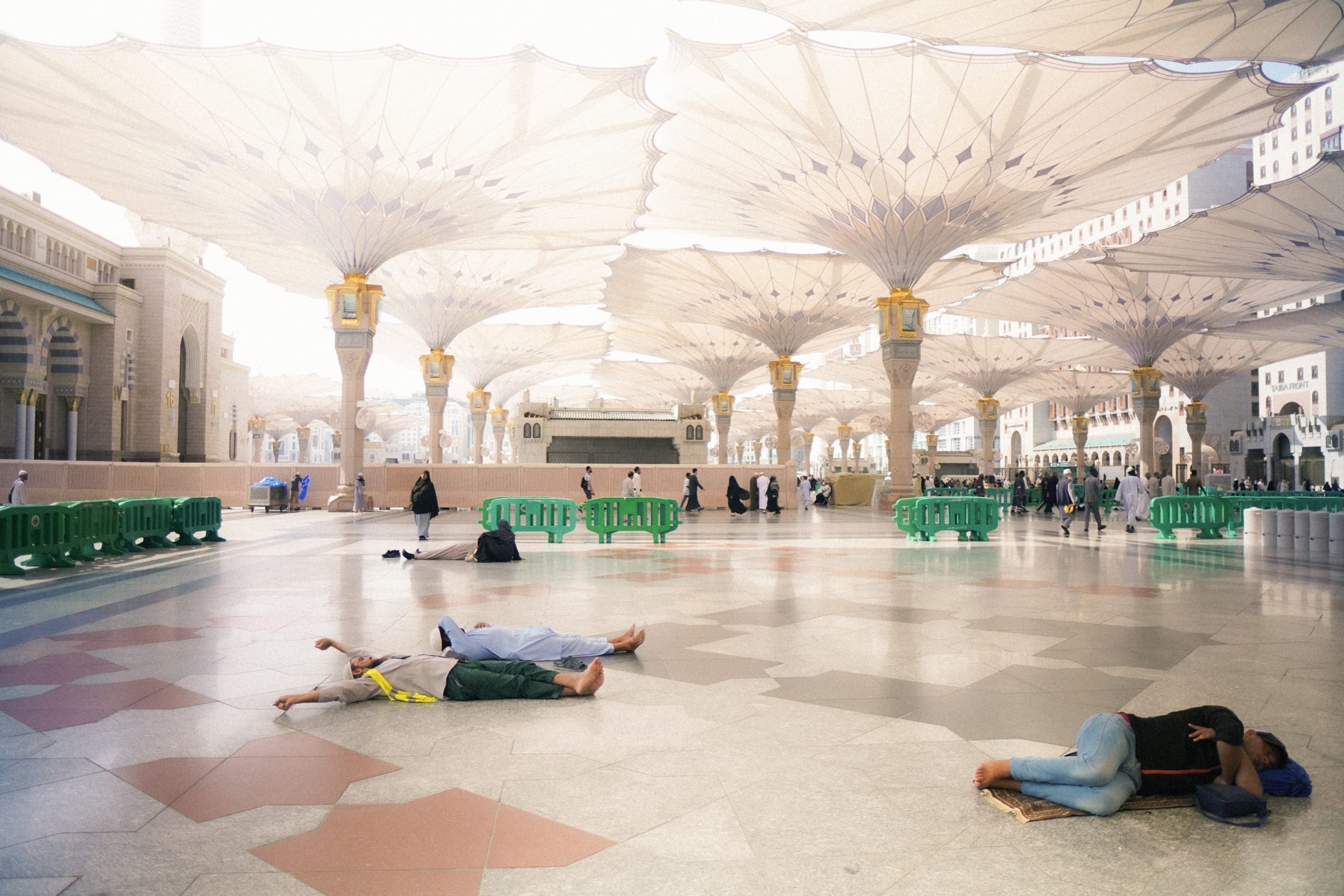 Men lazing outside Masjid e Nabawi