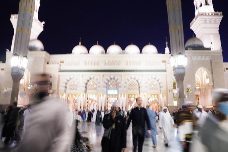 Men blurred outside the prophet's mosque