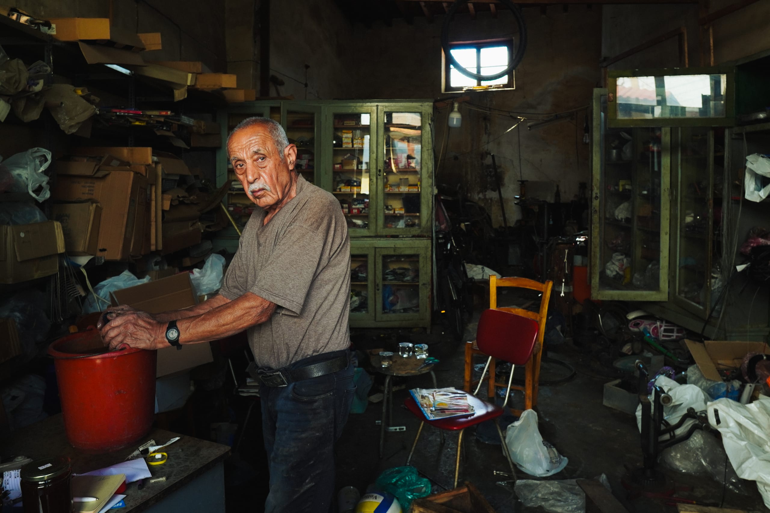 An elderly man in his workshop